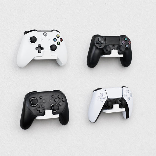 Wall-mounted gaming controller holders installed on a smooth painted wall