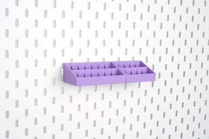 Empty purple 10-slot and 14-slot bobbin organizers mounted on an IKEA SKÅDIS pegboard