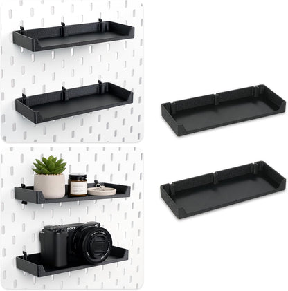 Black pegboard display shelves holding decor and a camera