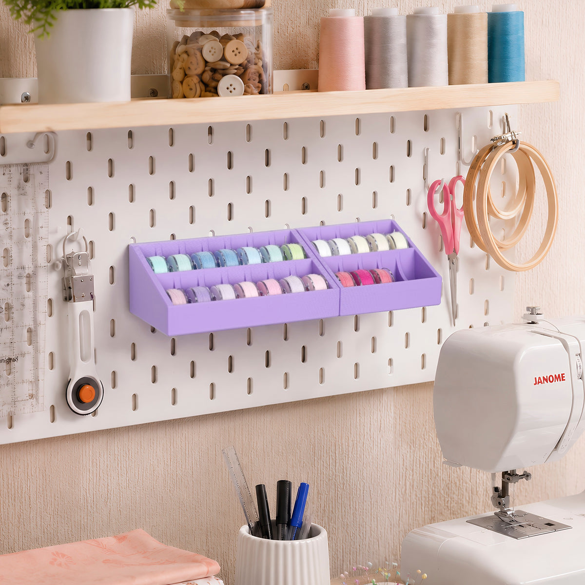Purple pegboard bobbin holders organizing sewing thread beside a sewing machine and embroidery hoops