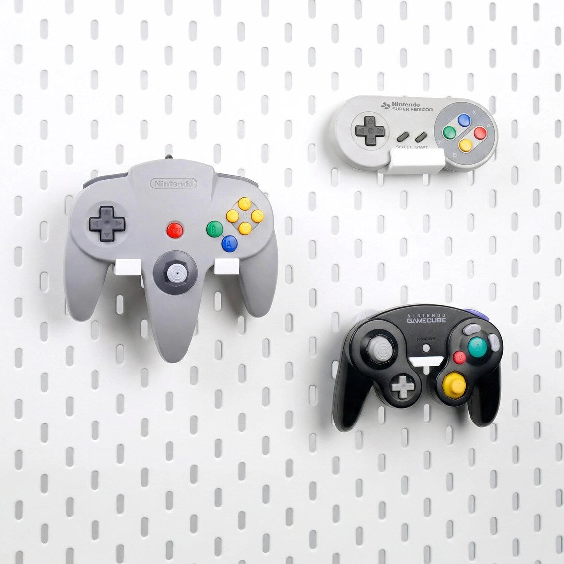 Side view of a GameCube controller displayed on a pegboard holder