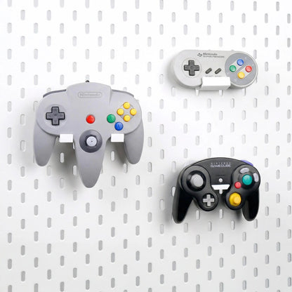 Side view of a GameCube controller displayed on a pegboard holder