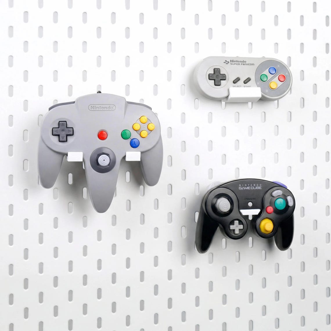 Side view of an N64 controller displayed on a pegboard holder
