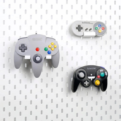 Side view of an SNES controller displayed on a pegboard holder