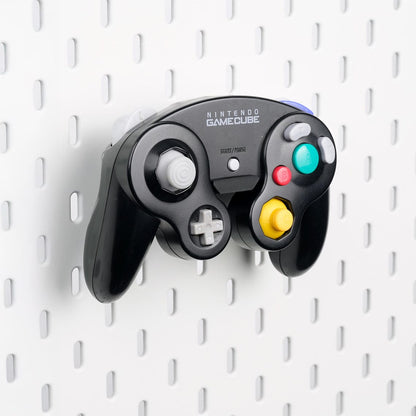 Pure Black GameCube controller holder mounted on an IKEA SKÅDIS pegboard