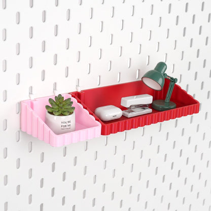 Pink and red wave pegboard storage shelves holding small desk accessories
